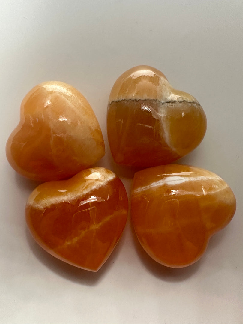 Orange Calcite polished hearts